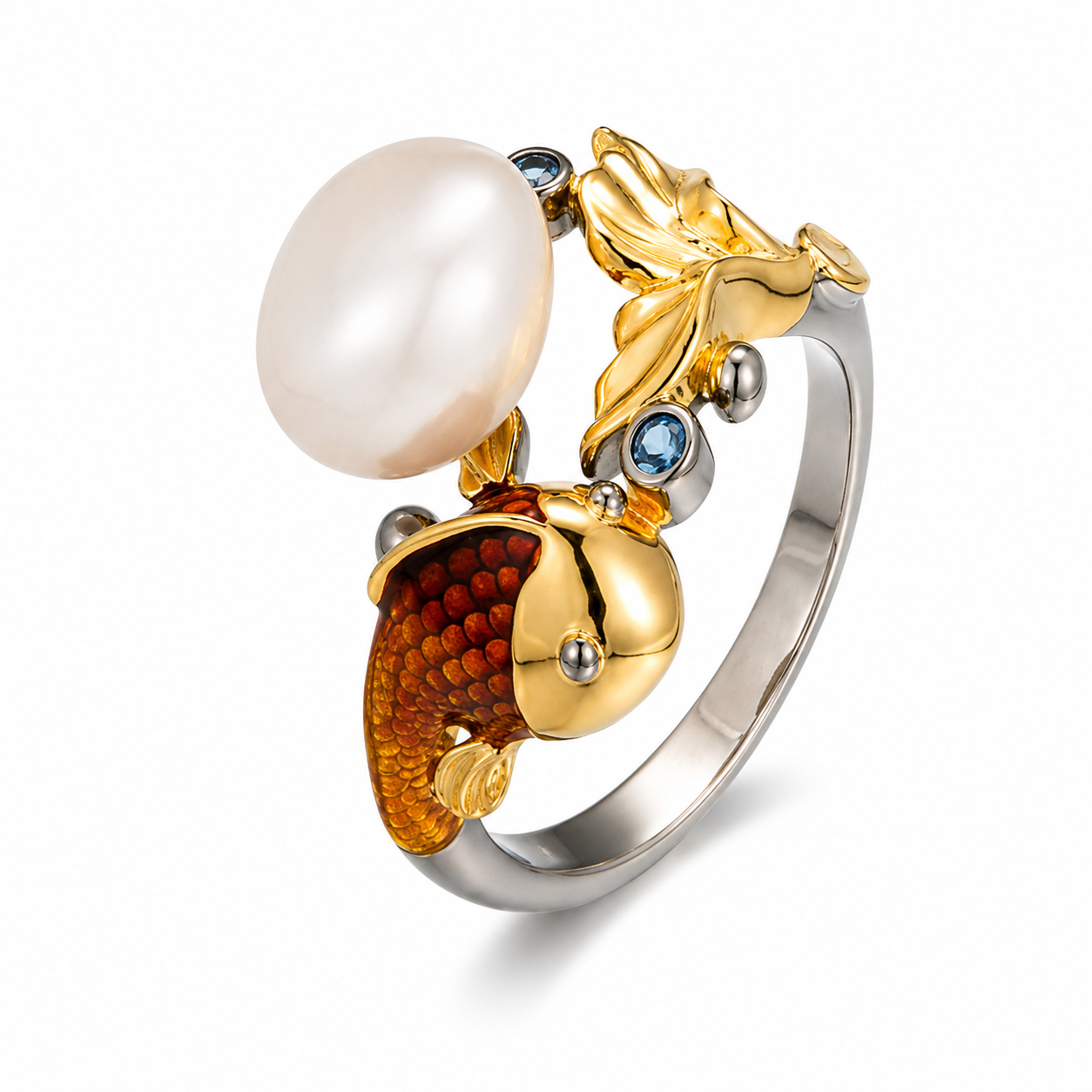 A gold and silver ring featuring a large white pearl, a gold leaf motif, and a gold fish-shaped setting with amber detailing and small blue gemstones, shown on a white background.
