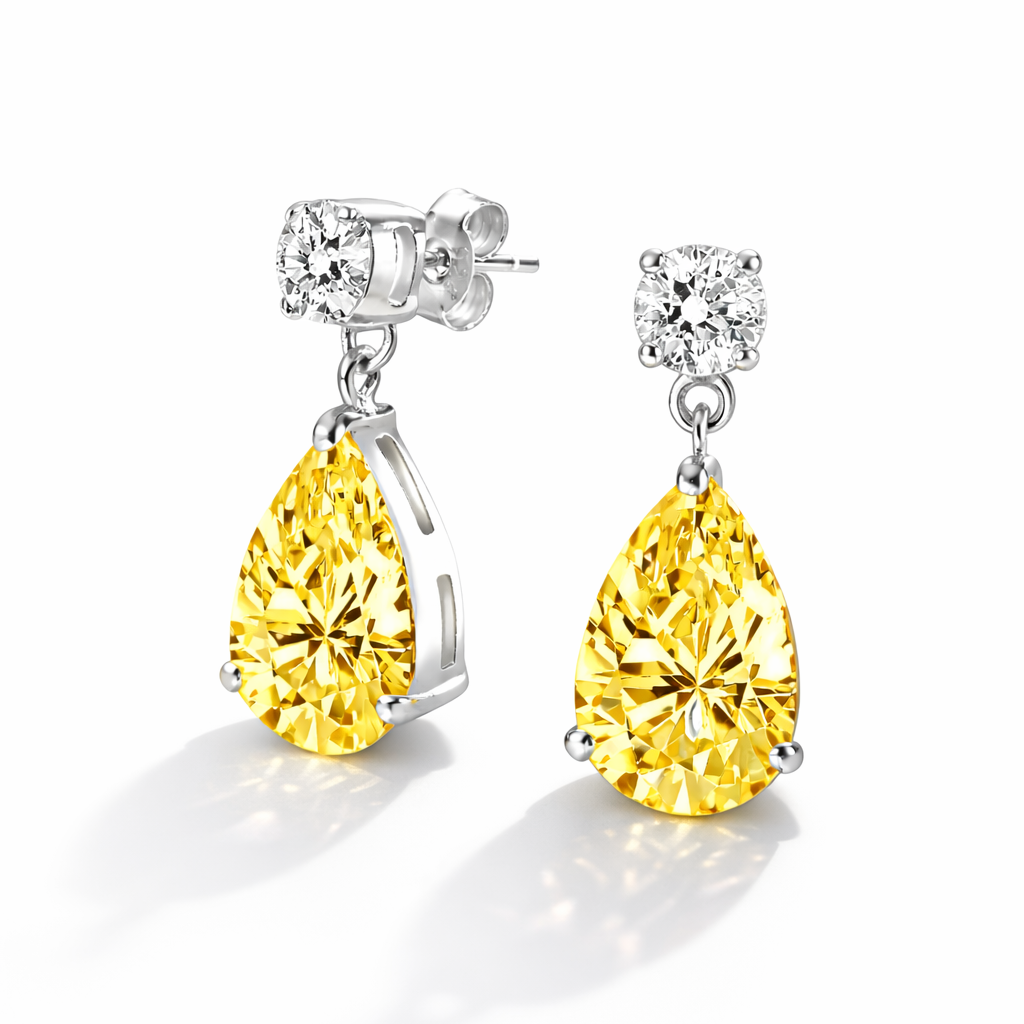 Vathe Golden Drop V5558 me zirkone te verdhe ne forme dardhe dhe gure te bardhe rrethore siper, cift ne sfond te bardhe | Argjend 925 | Penelope Jewellery